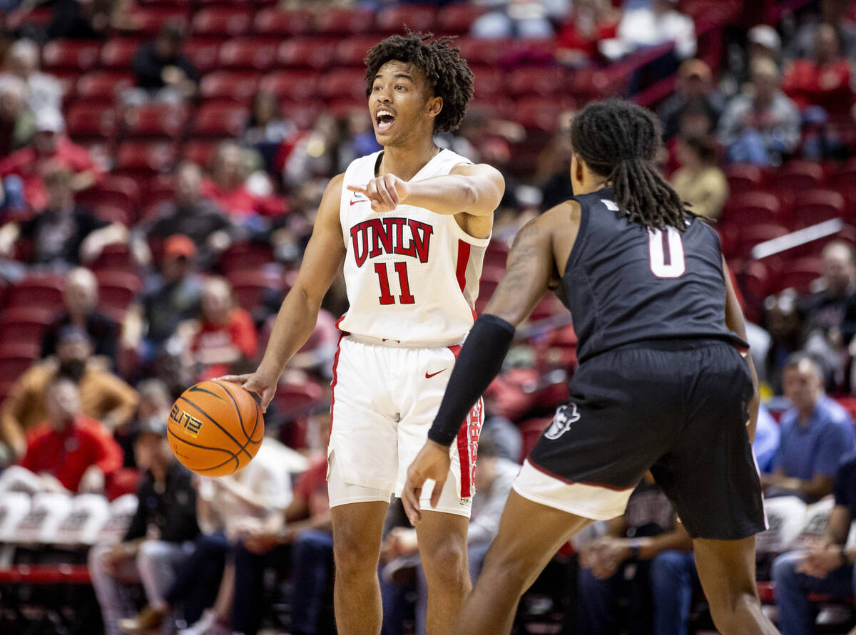 UNLV guard Dedan Thomas Jr. (11) calls a play during the college basketball game against the Ne ...