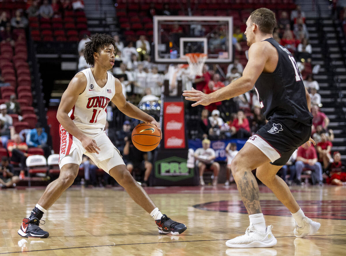 UNLV guard Dedan Thomas Jr. (11) looks to make a play during the college basketball game agains ...