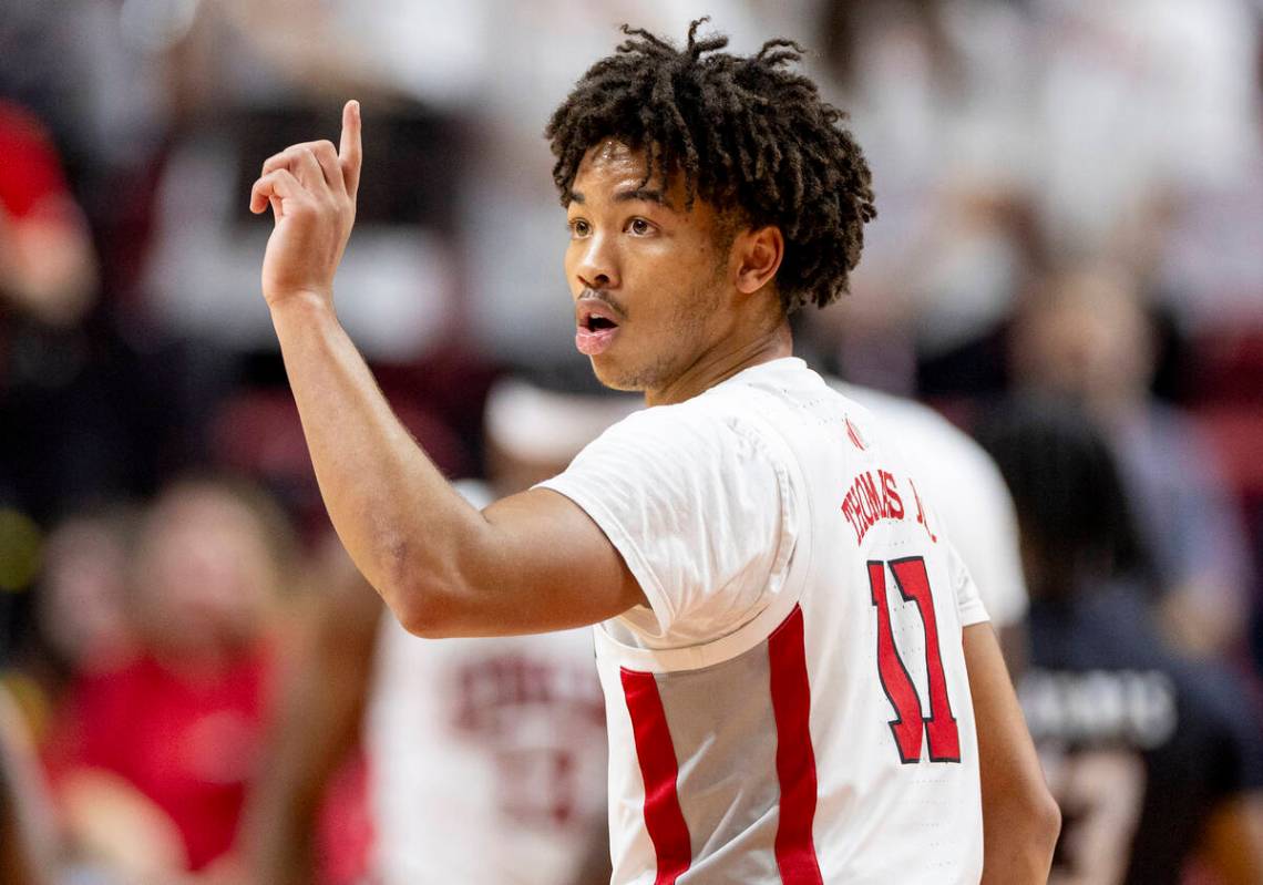 UNLV guard Dedan Thomas Jr. (11) looks for a play call during the college basketball game again ...