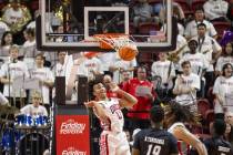 UNLV guard Dedan Thomas Jr. (11) smiles after scoring a slam dunk during the college basketball ...