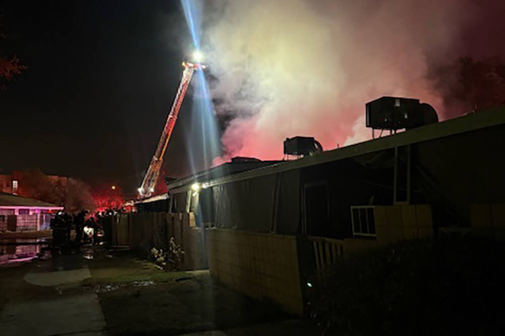 Crews battle a fire Saturday, Nov. 23, 2024, at The Paradise Spas condominium complex at 9457 L ...