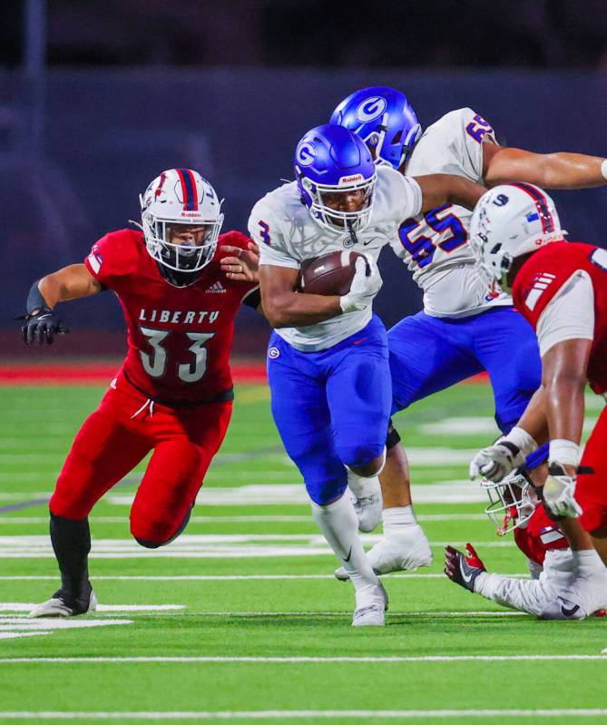 Bishop Gorman running back Terrance Grant (3) runs the ball down the field during a high school ...