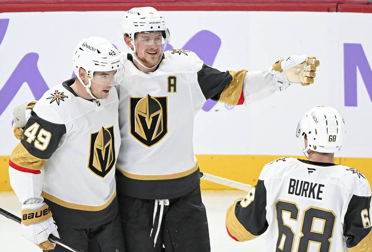 Vegas Golden Knights' Ivan Barbashev (49) celebrates with teammates Jack Eichel (9) and Callaha ...