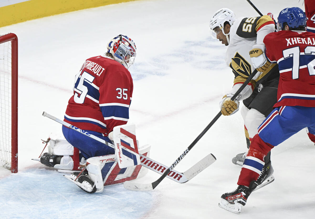 Vegas Golden Knights Keegan Kolesar (55) scores against Montreal Canadiens goaltender Sam Monte ...