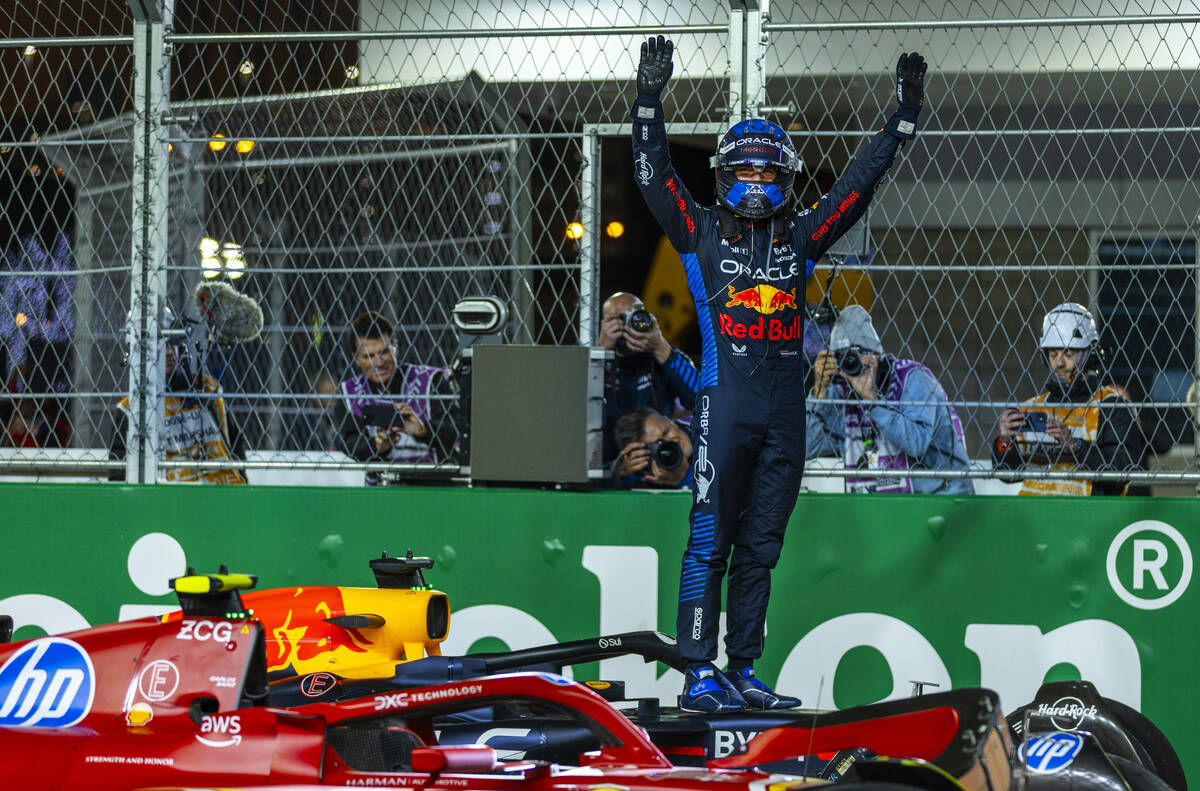 Red Bull Racing driver Max Verstappen celebrates his championship win for the season at the fin ...