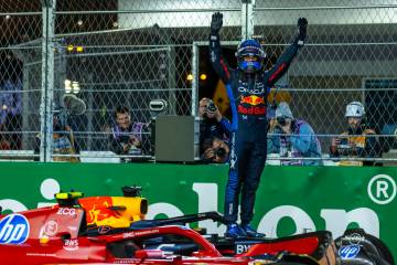 Red Bull Racing driver Max Verstappen celebrates his championship win for the season at the fin ...