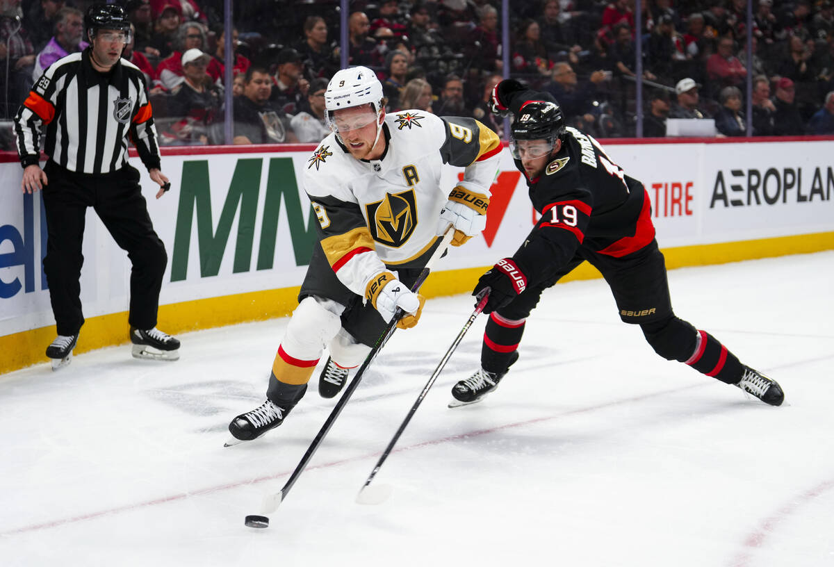 Vegas Golden Knights centre Jack Eichel (9) skates the puck past Ottawa Senators right wing Dra ...