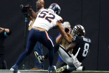 Raiders running back Ameer Abdullah (8) scores a touchdown as Denver Broncos linebacker Jonah E ...