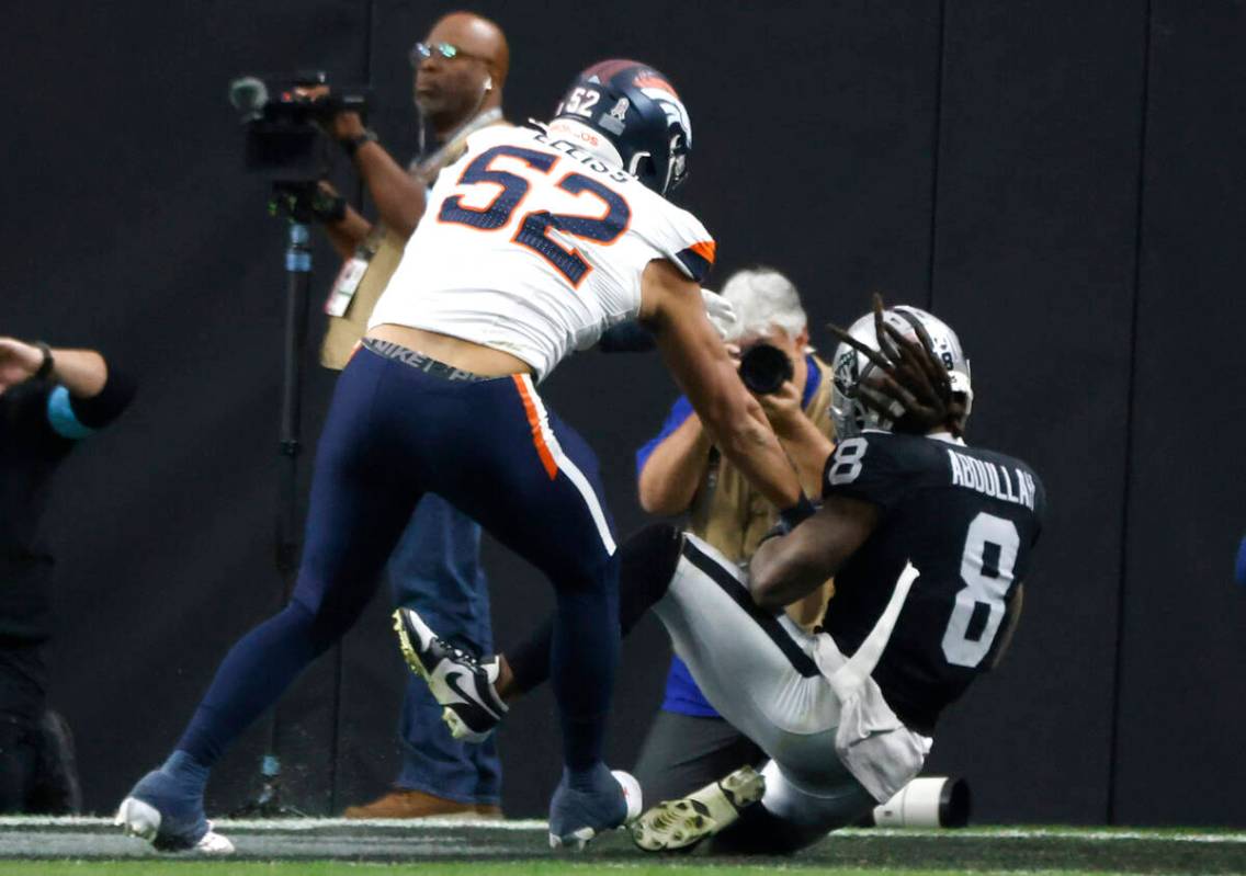 Raiders running back Ameer Abdullah (8) scores a touchdown as Denver Broncos linebacker Jonah E ...