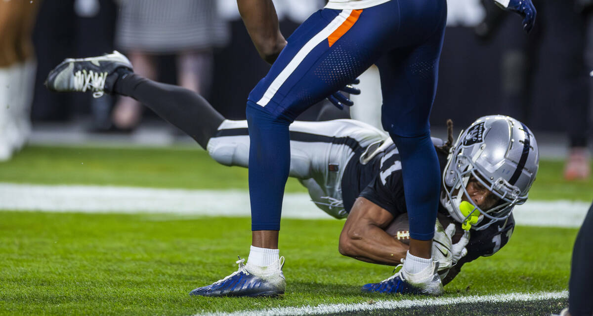 Raiders wide receiver Tre Tucker (11) dives for the end zone but comes up short against the Den ...