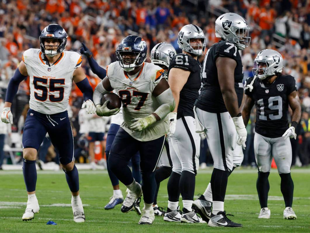 Denver Broncos defensive tackle Malcolm Roach (97) celebrates after recovering the ball that wa ...