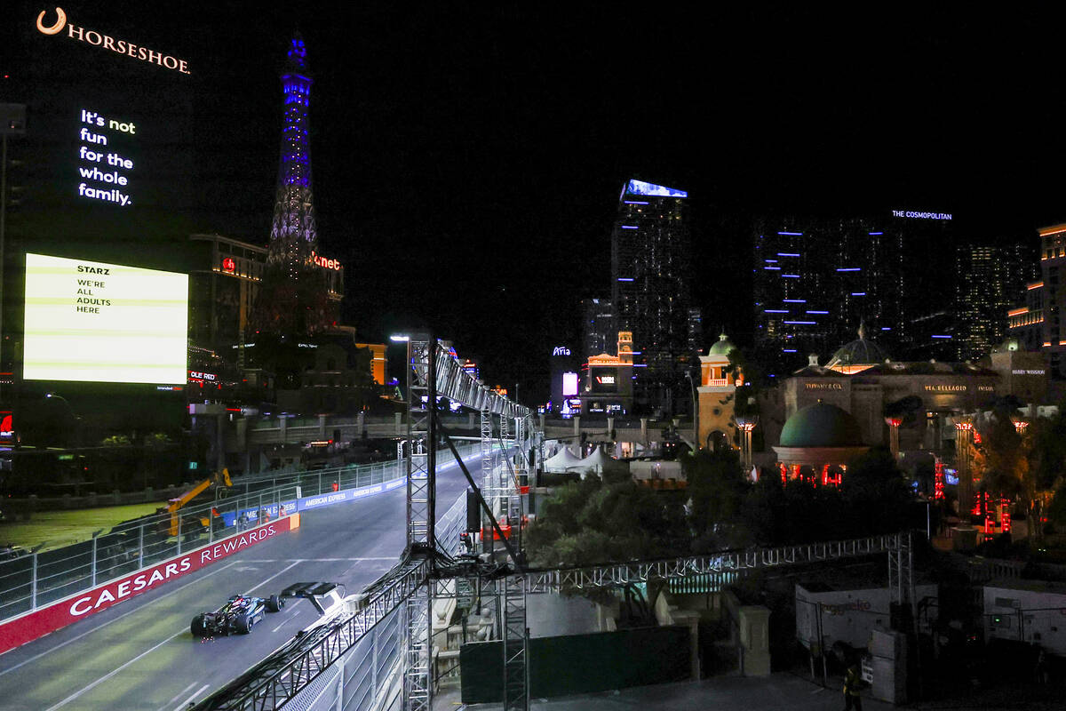 A race car driver navigates the circuit during the Formula 1 Las Vegas Grand Prix on the Strip ...