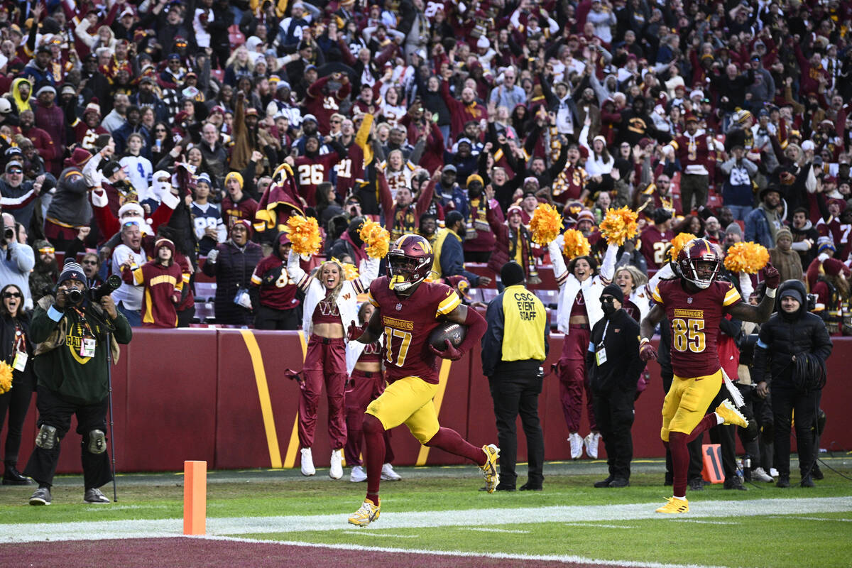 Washington Commanders wide receiver Terry McLaurin (17) scores an 86-yard touchdown during the ...