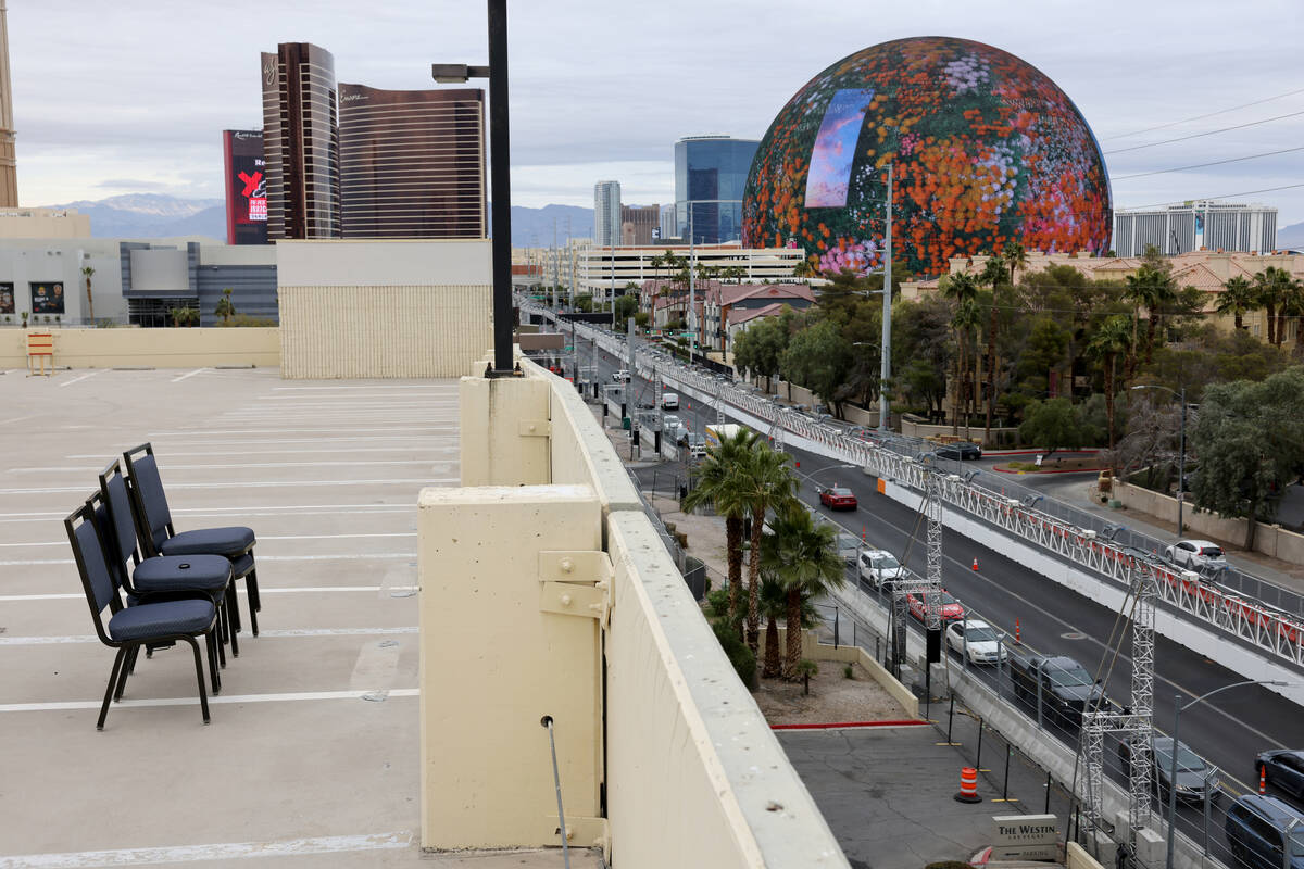 Workers dismantle the Formula One Las Vegas Grand Prix track on Koval Lane at Flamingo Road in ...