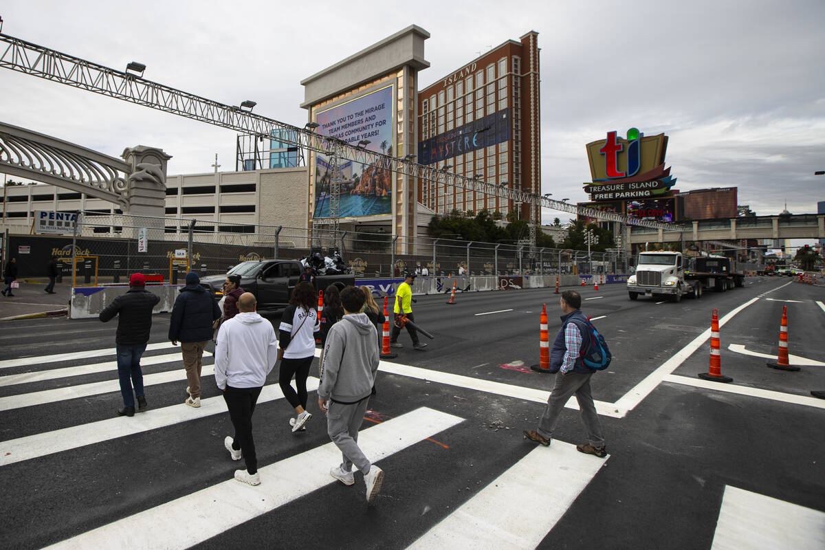 Crews work to take down the Formula One Las Vegas Grand Prix track and repaint lane markings al ...