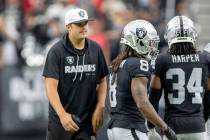 Raiders quarterback Aidan O'Connell, left, is seen with his fractured right thumb wrapped up as ...