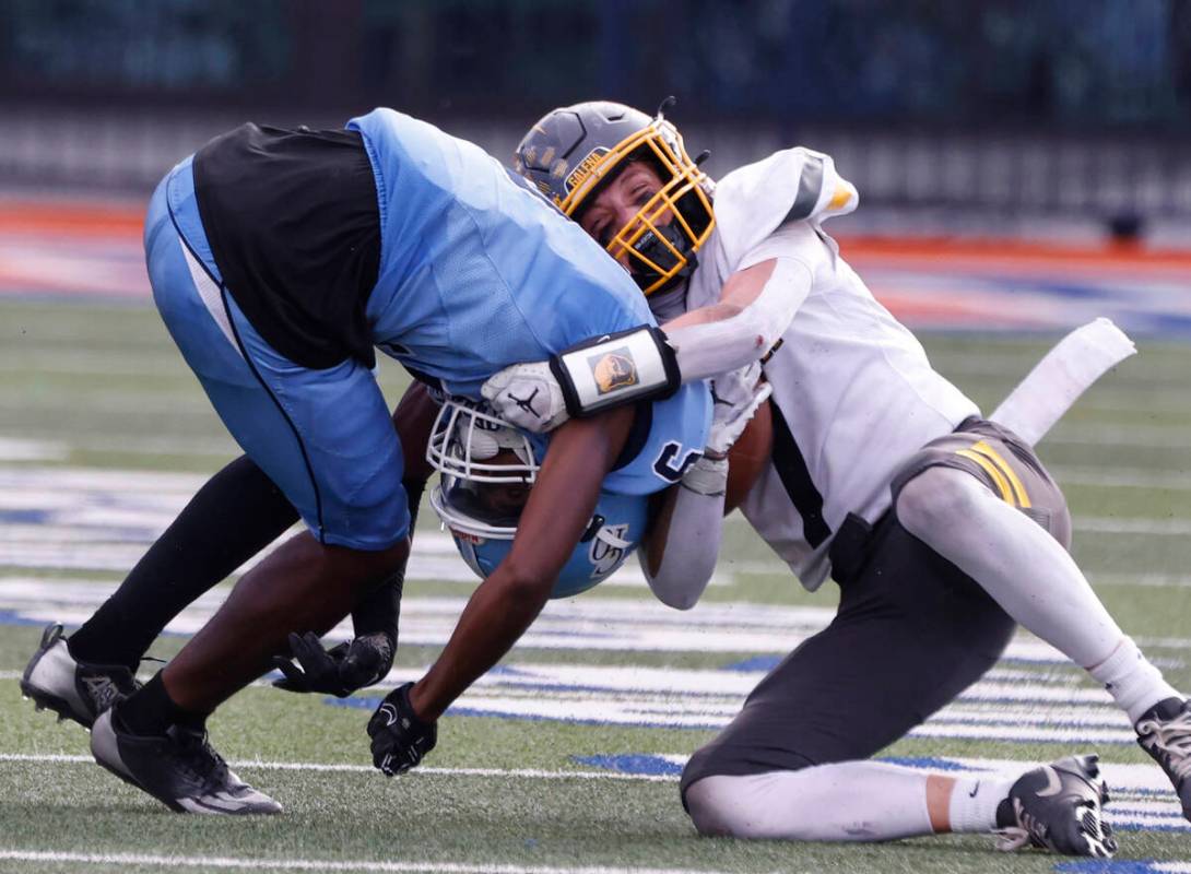 Centennial High's cornerback Jhbari Christmas (9) tackles Galena High's wide receiver Zak Smrt ...