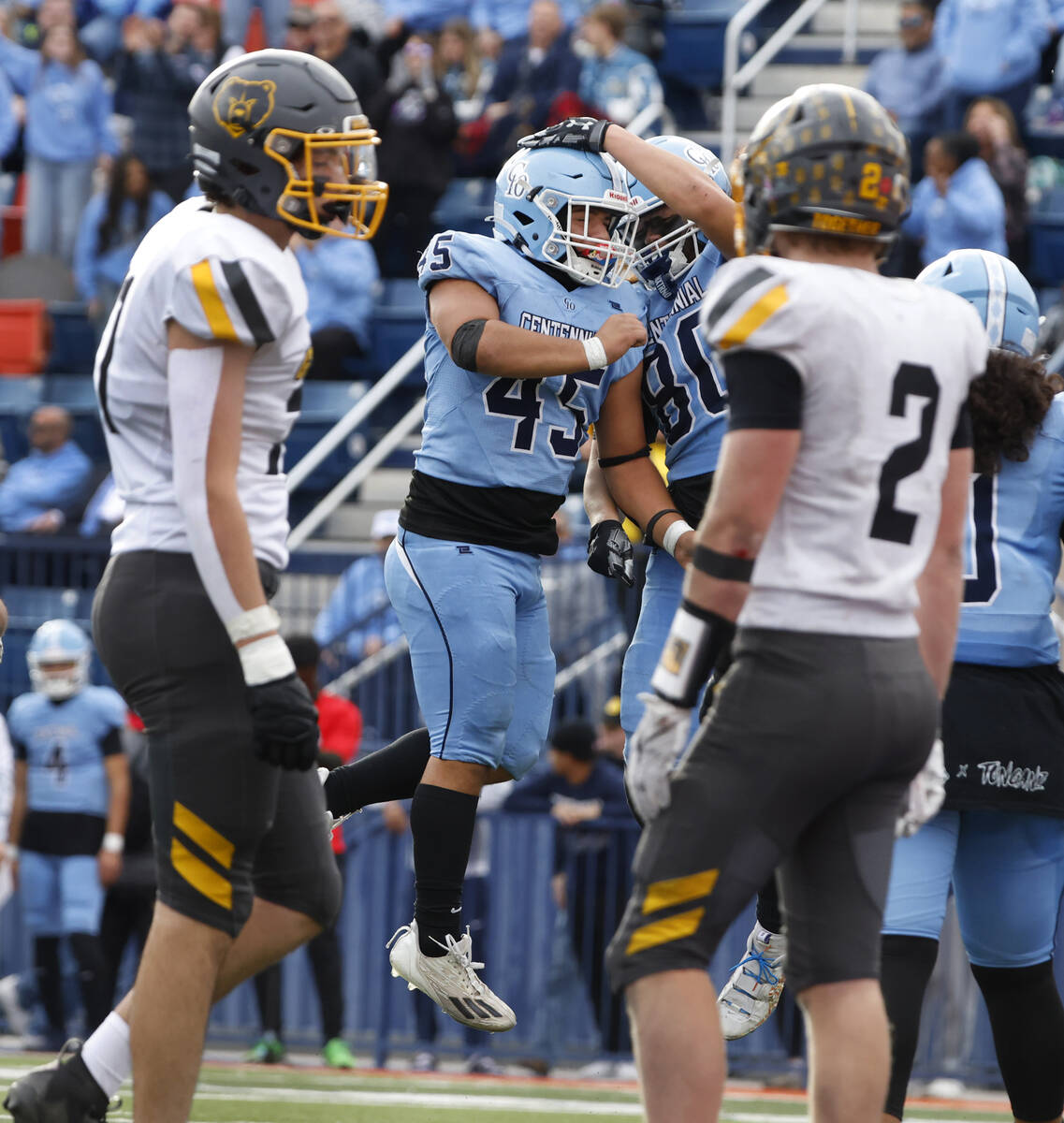 Centennial High's free safety Brayden Hicks (45) celebrates his touchdown with tight end Bailey ...