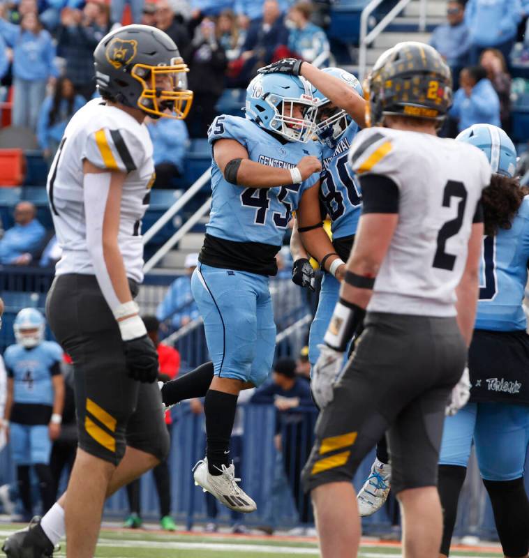 Centennial High's free safety Brayden Hicks (45) celebrates his touchdown with tight end Bailey ...