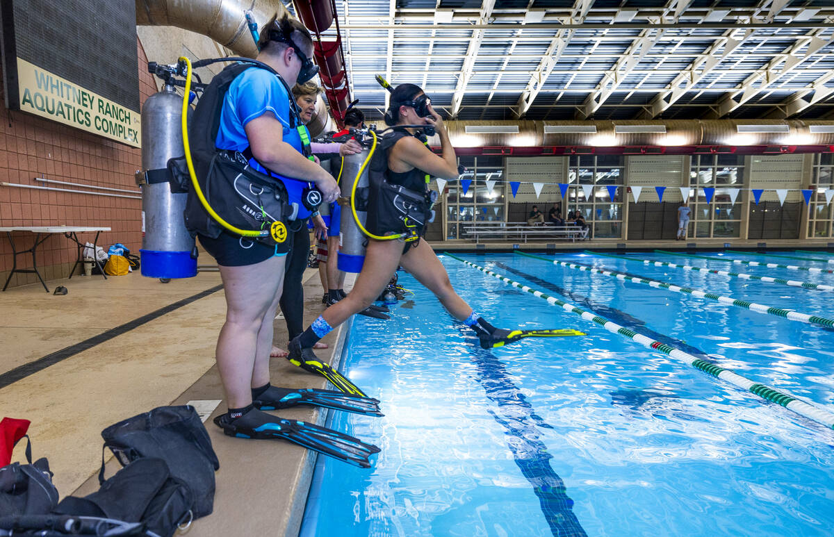 A student enters the water during a Sin City Scuba class at the Whitney Ranch Aquatic Center on ...