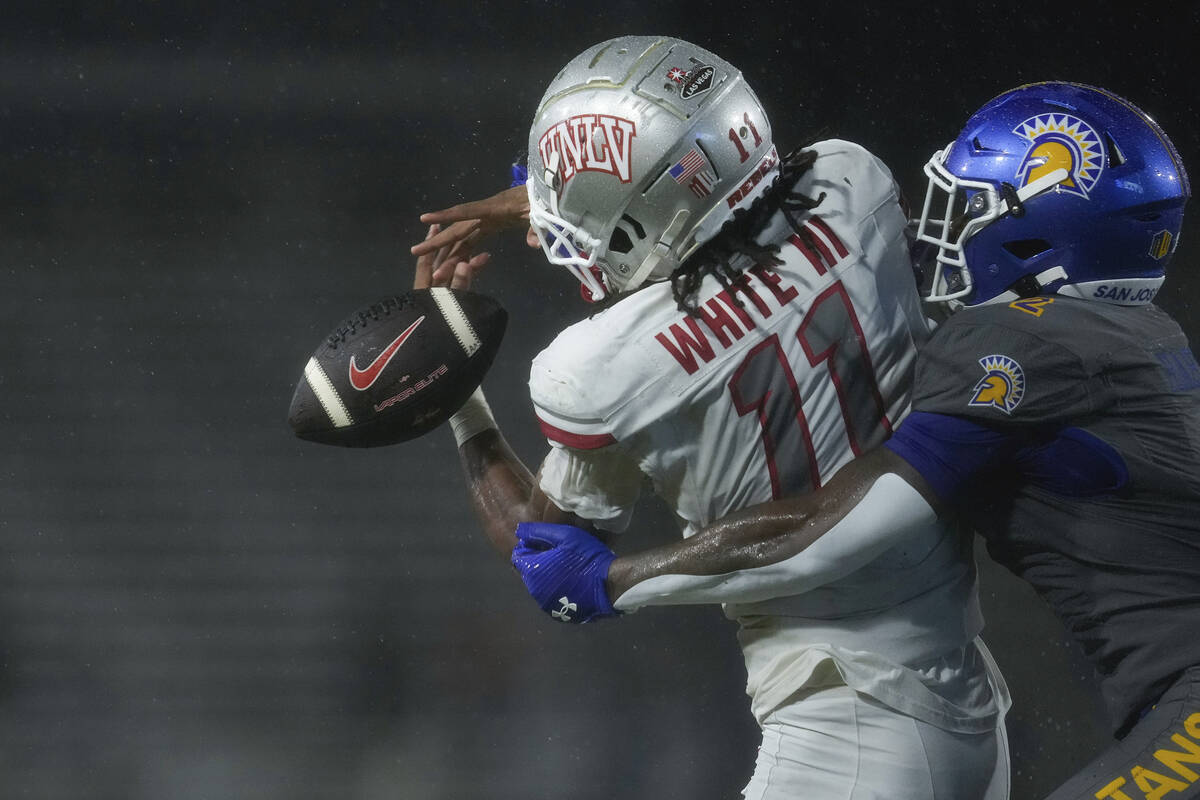 San Jose State defensive back DJ Harvey, right, breaks up a pass intended for UNLV wide receive ...