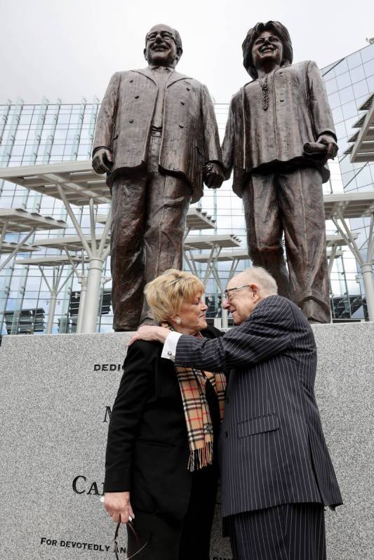 Las Vegas Mayor Carolyn Goodman and former Mayor Oscar Goodman kiss during the unveiling of a s ...