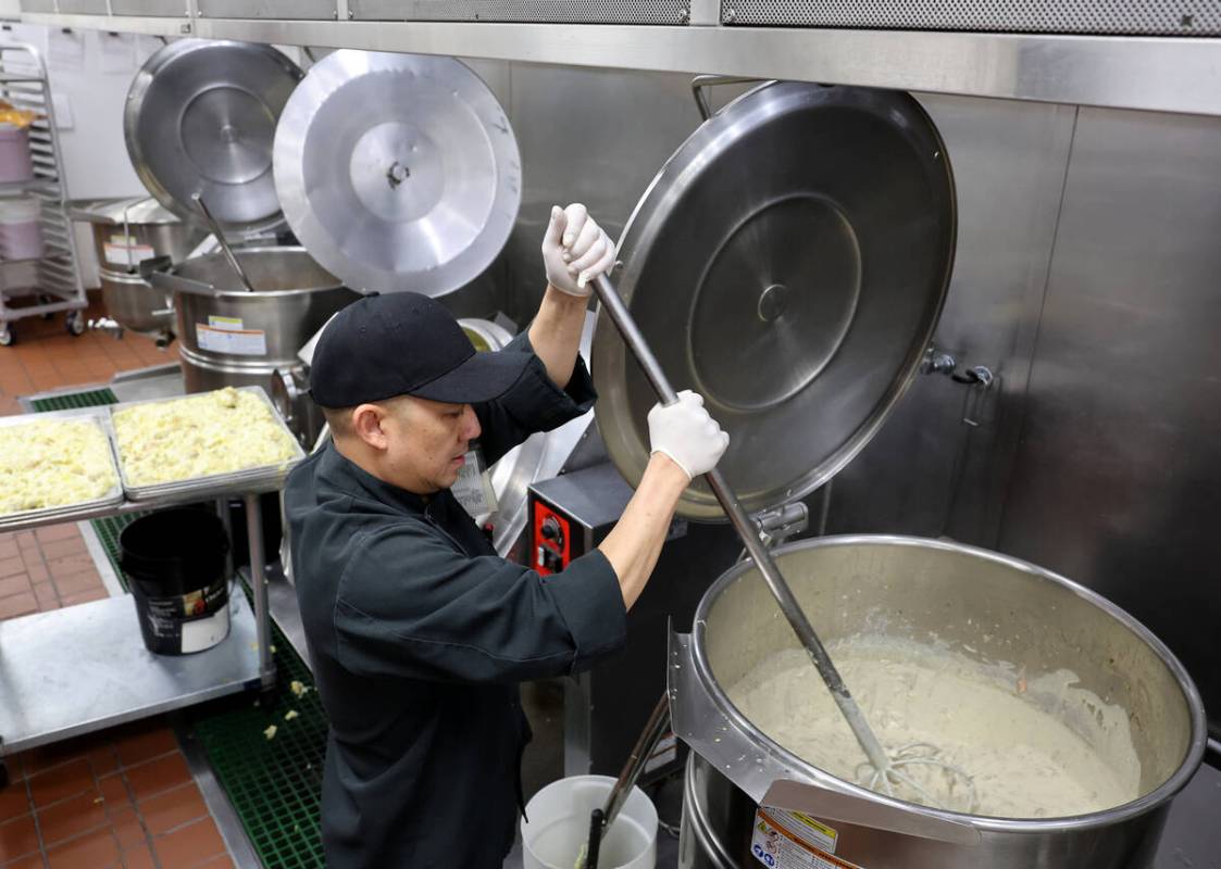 Executive chef Jun Lao prepares to serve 700 Thanksgiving meals at Catholic Charities of Southe ...