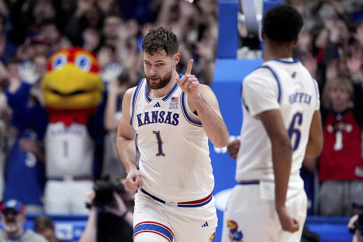 Kansas center Hunter Dickinson (1) celebrates after dunking the ball during the second half of ...