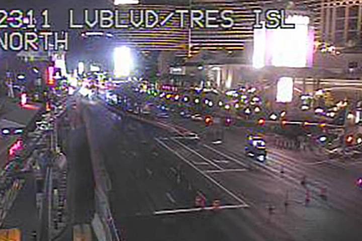 Police (far background) have the Las Vegas Strip blocked as they investigate a fatal shooting t ...