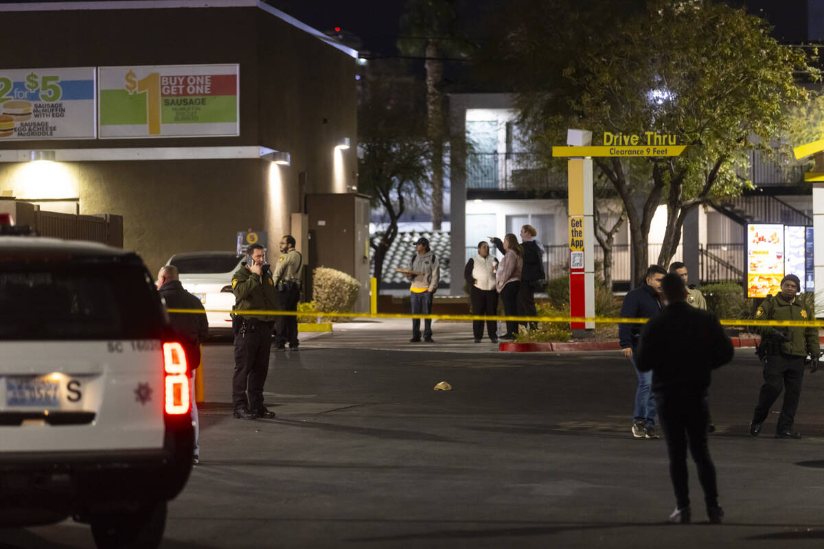 Las Vegas police investigate the scene of a homicide at a McDonald’s on Paradise Road on ...