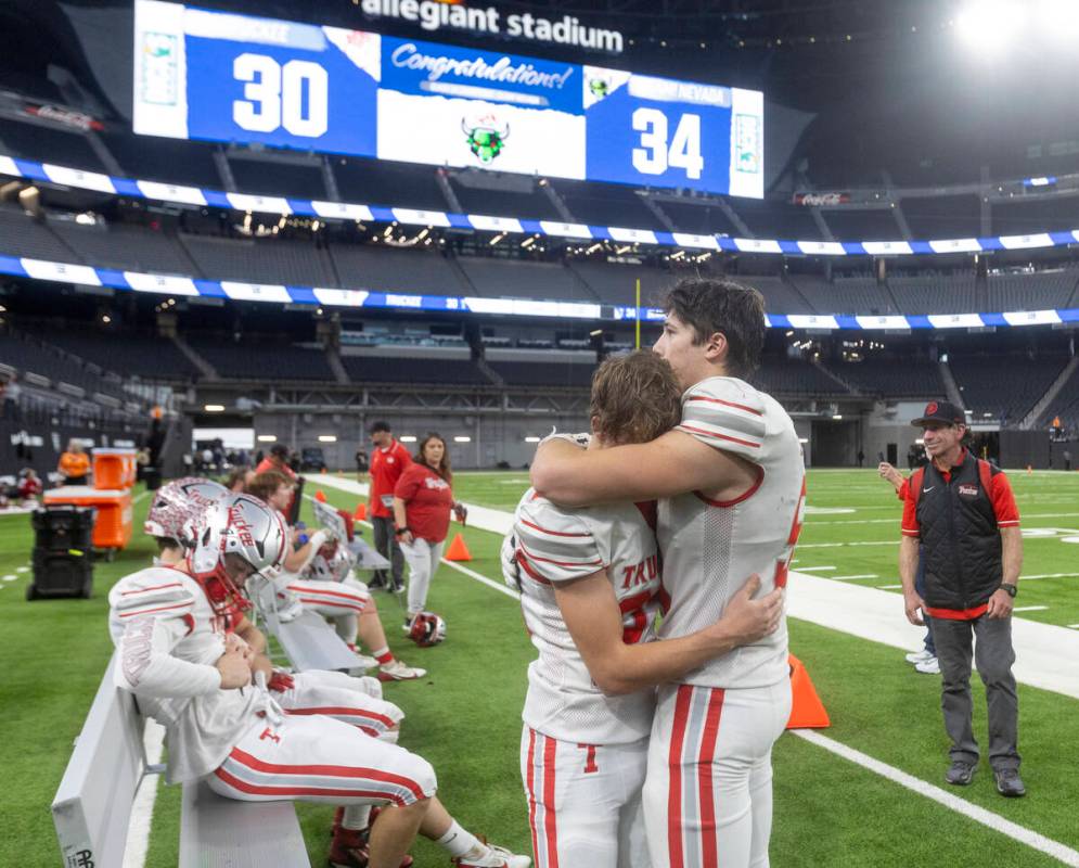 Truckee players hug after losing the Class 3A football state championship game against SLAM Aca ...