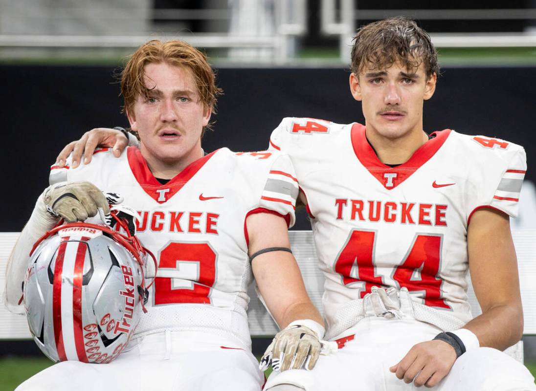 Truckee senior Colby Jitloff, left, and Truckee senior Paul Ronzone, right, console each other ...