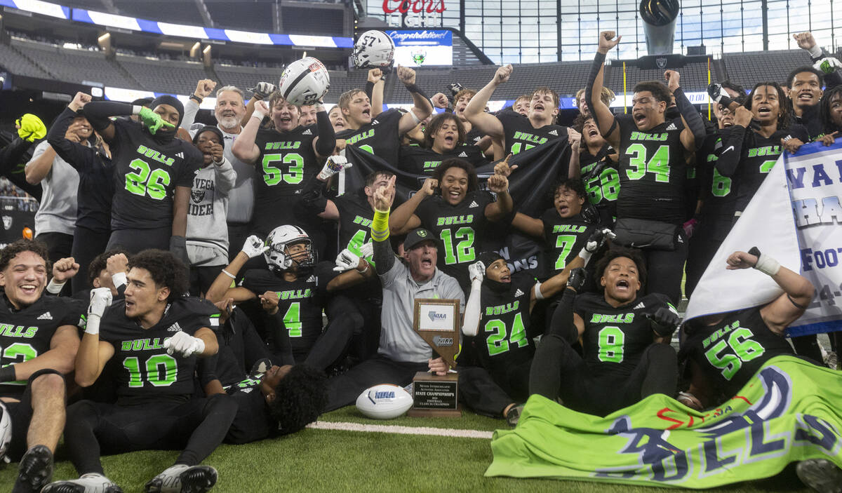 SLAM Academy celebrates after winning the Class 3A football state championship game against Tru ...