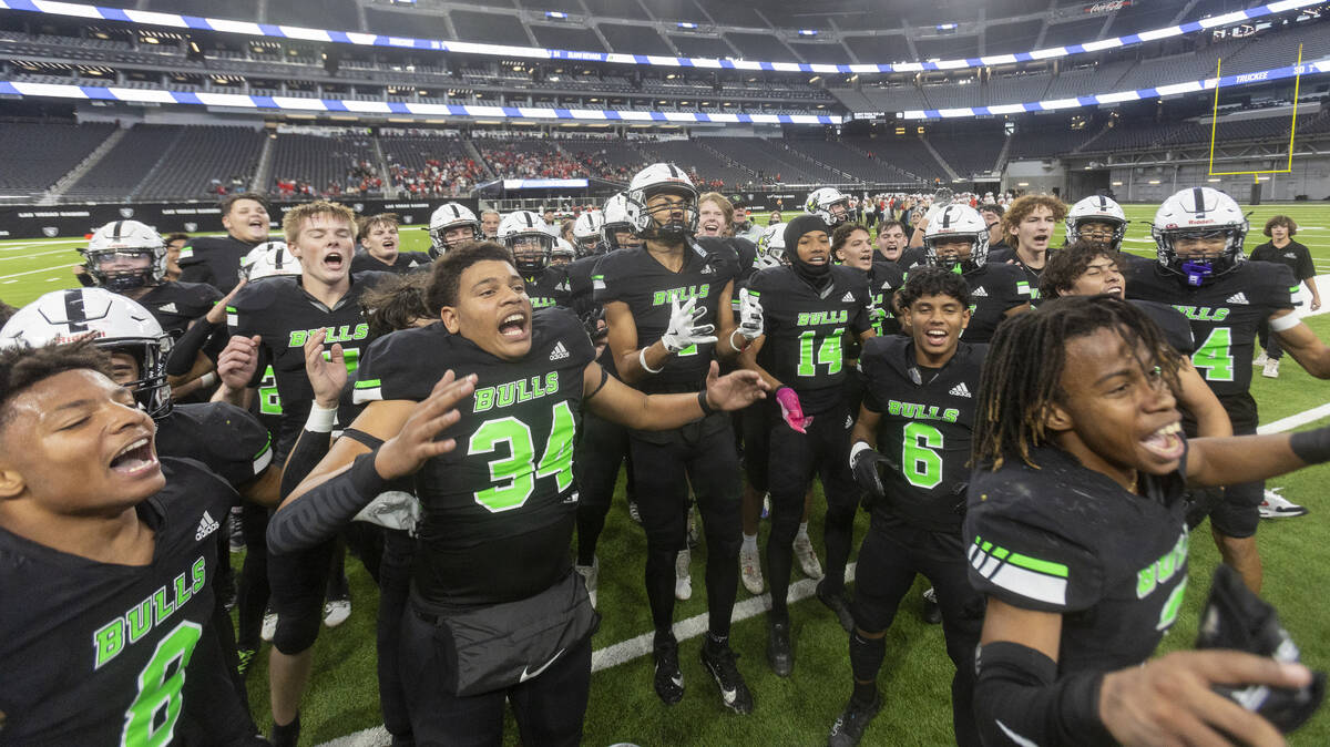 SLAM Academy celebrates with the crowd after winning the Class 3A football state championship g ...