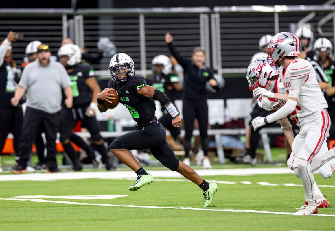 SLAM Academy junior Alaijah Young (2) runs in the open field during the Class 3A football state ...