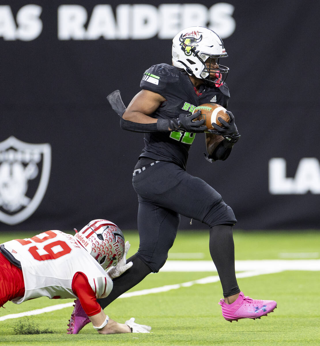 SLAM Academy senior Damien Nevil (12) runs into the end zone for a touchdown during the Class 3 ...