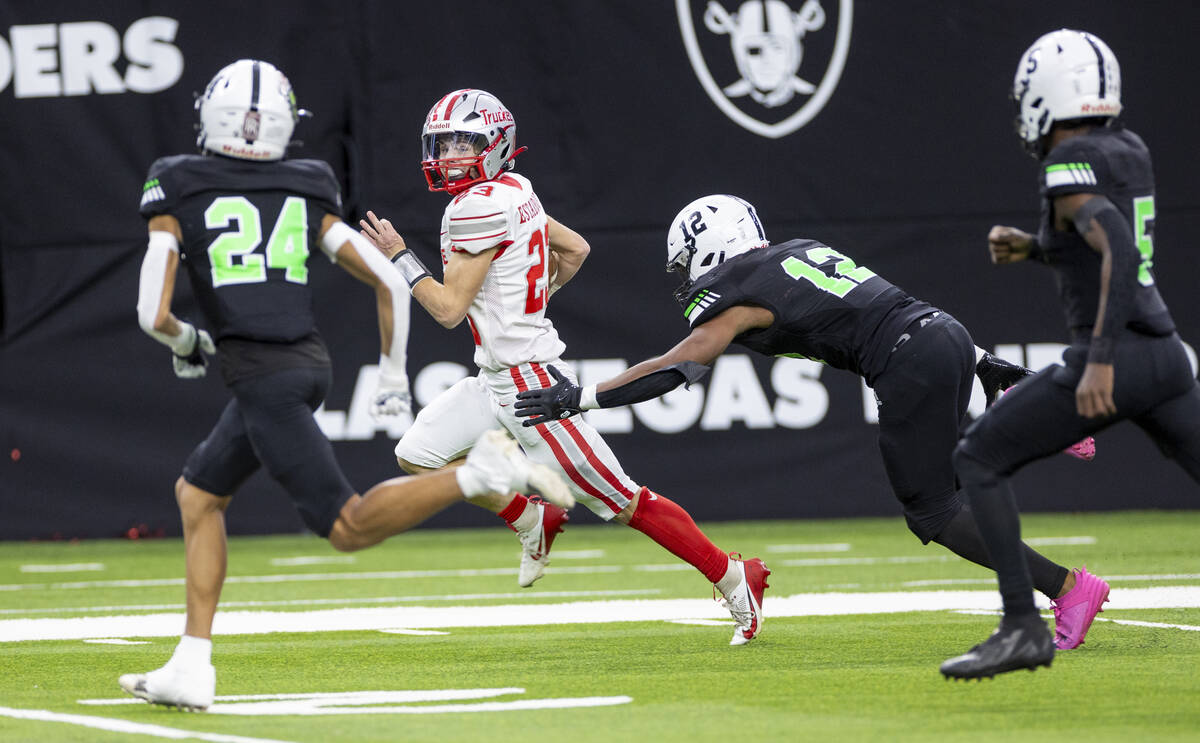 Truckee senior Jace Estabrook (23) runs with the ball during the Class 3A football state champi ...