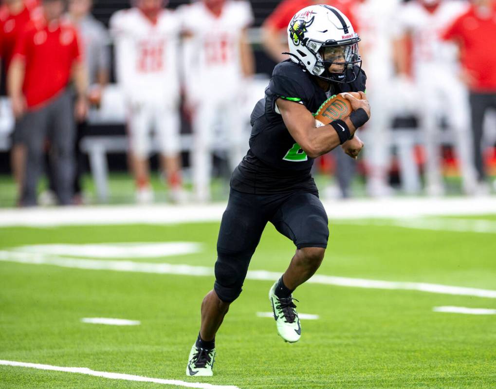 SLAM Academy junior Alaijah Young (2) runs with the ball during the Class 3A football state cha ...