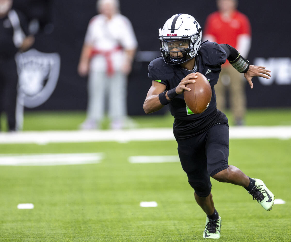 SLAM Academy junior Alaijah Young (2) runs with the ball during the Class 3A football state cha ...