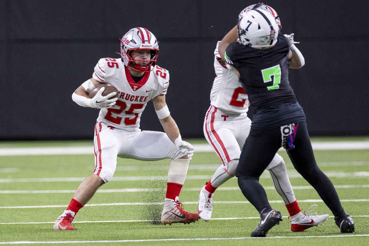 Truckee senior Joseph Birnbaum (25) runs with the ball during the Class 3A football state champ ...