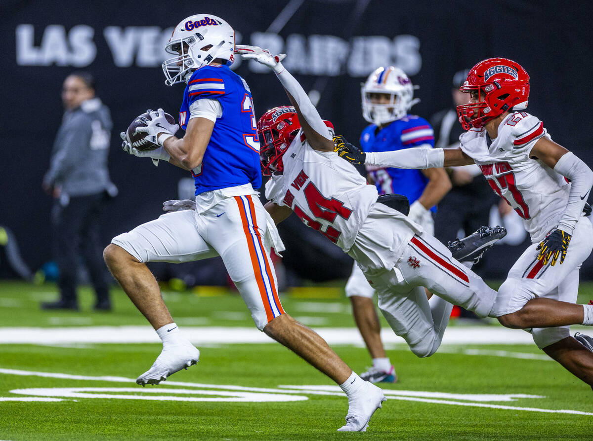 Bishop Gorman wide receiver Derek Meadows (30) hauls in a long pass over Arbor View cornerback ...