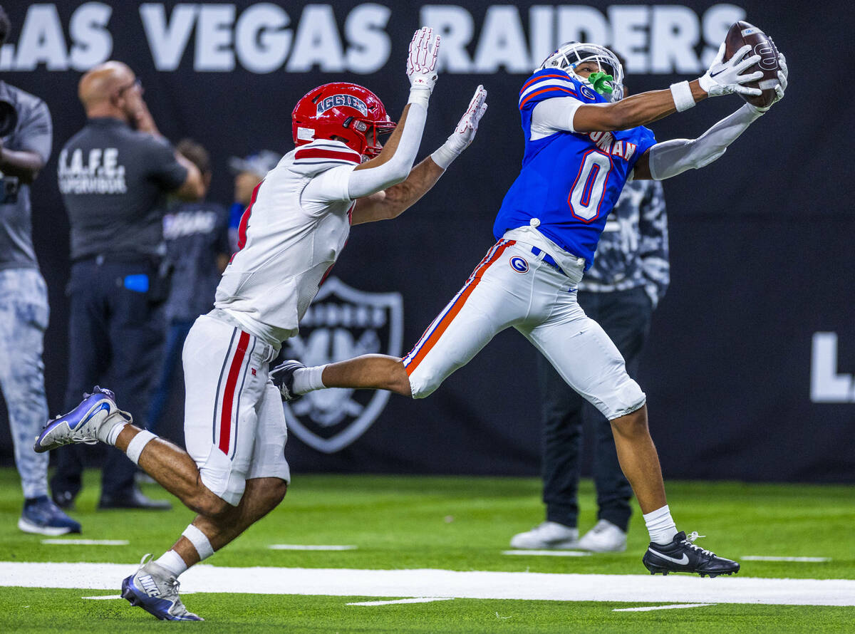 Bishop Gorman wide receiver Isaiah Nickels (0) hauls in a touchdown pass over Arbor View corner ...