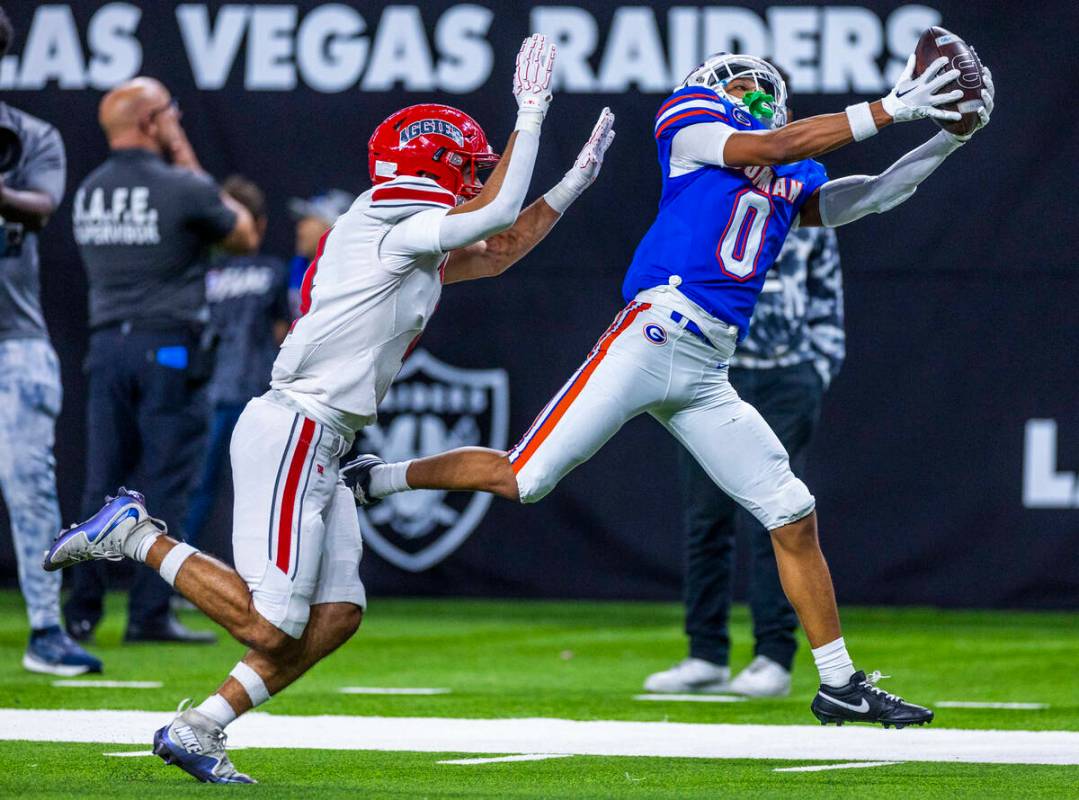 Bishop Gorman wide receiver Isaiah Nickels (0) hauls in a touchdown pass over Arbor View corner ...