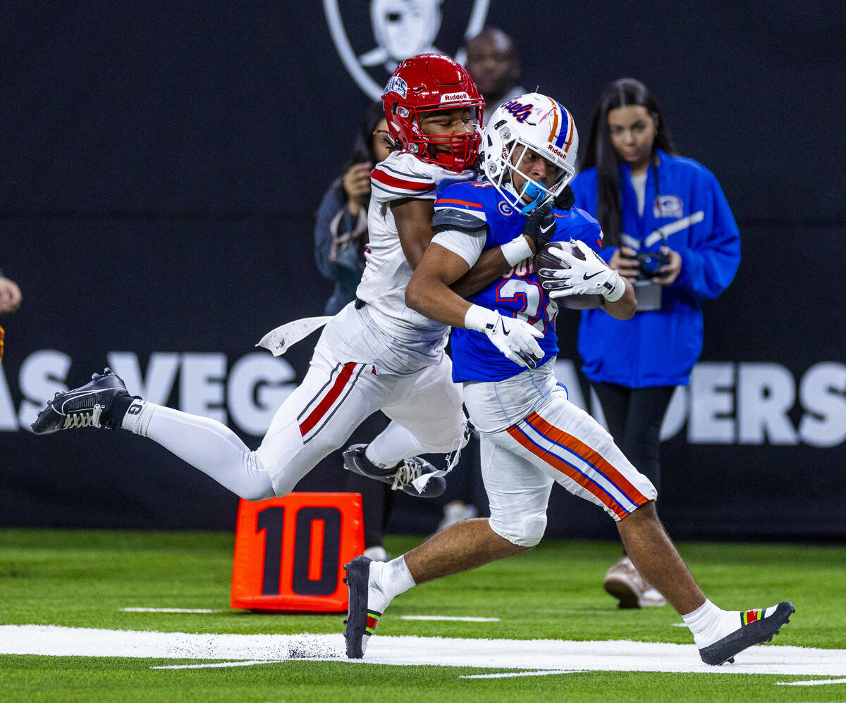 Bishop Gorman running back Myles Norman (24) drags Arbor View safety Tico Pringle (4) towards ...