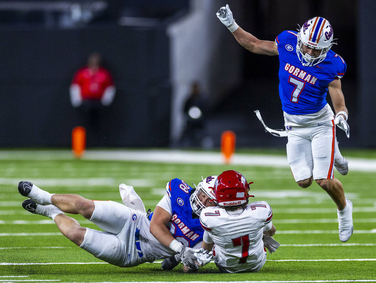 Arbor View quarterback Thaddeus Thatcher (7) slides for a first down as Bishop Gorman linebacke ...