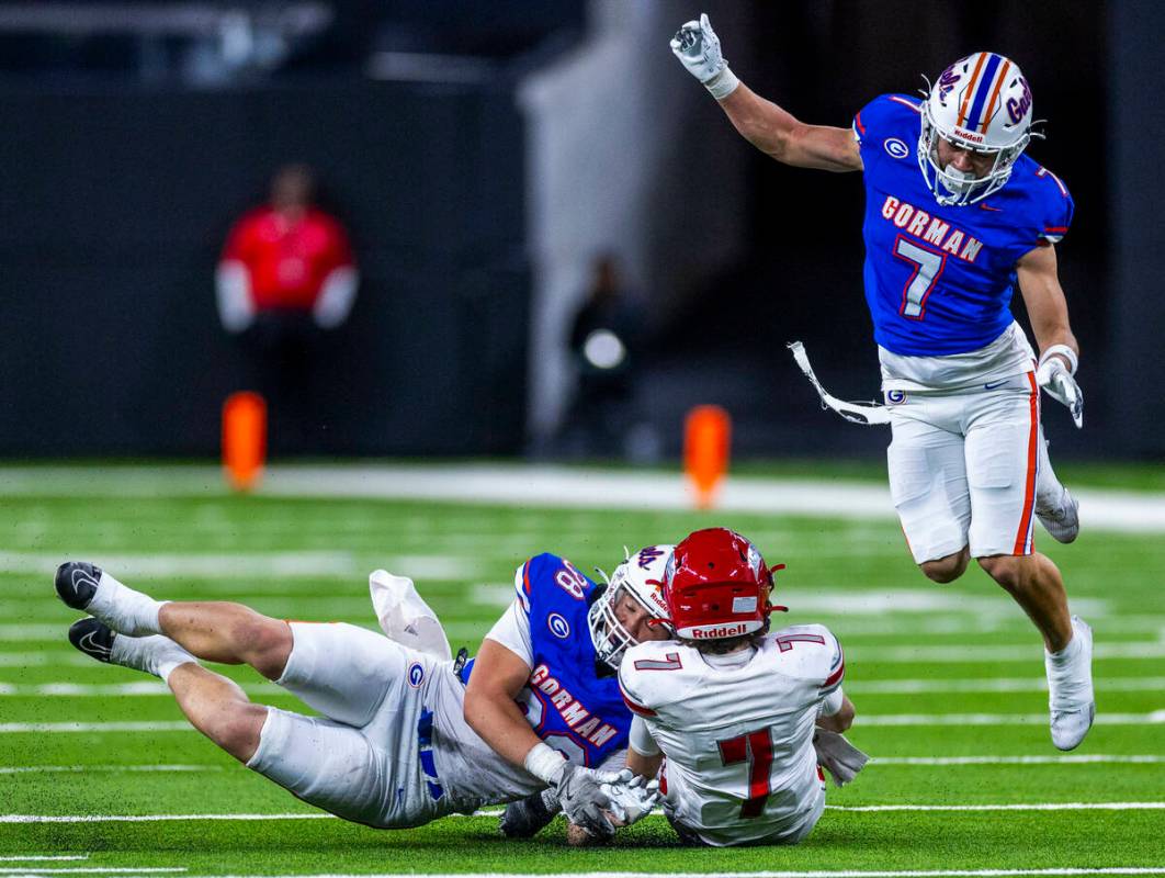 Arbor View quarterback Thaddeus Thatcher (7) slides for a first down as Bishop Gorman linebacke ...