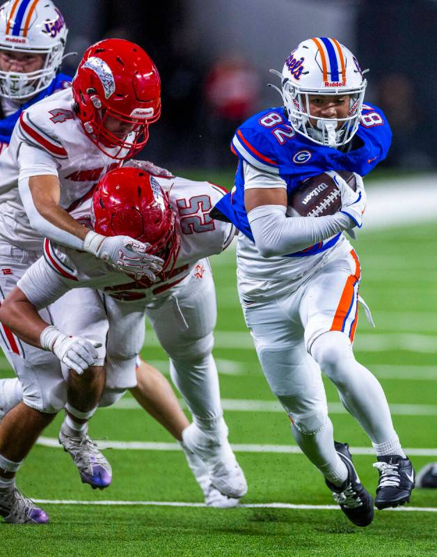 Bishop Gorman wide receiver Zyren Menor (82) heads for open territory as Arbor View defensive l ...