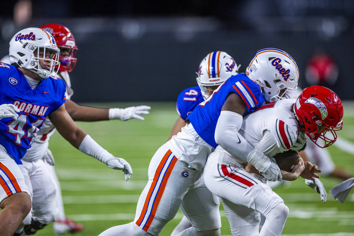 Arbor View quarterback Thaddeus Thatcher (7) is sacked by Bishop Gorman defensive lineman James ...