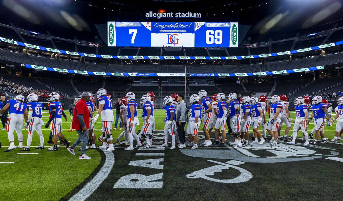 Bishop Gorman players greet Arbor View players following their 69-7 win for another Class 5A Di ...