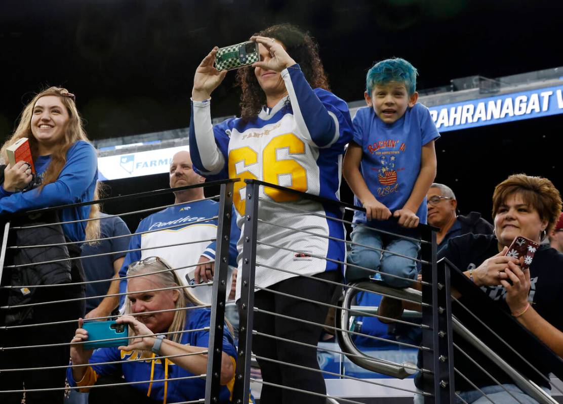 Pahranagat Valley fans take pictures of players after topping Tonopah 28-6 to win the state Cla ...